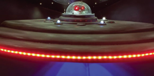 A picture of an alien in a spaceship in an alien-themed escape room